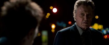 Movie still from “Stand Up Guys” (2012), directed by Fisher Stevens – A man standing in front of a street light; Close Up shot, Over the shoulder angle