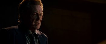 Movie still from “Stand Up Guys” (2012), directed by Fisher Stevens – An older man in a suit and tie looking at the camera; Close Up shot, Low angle