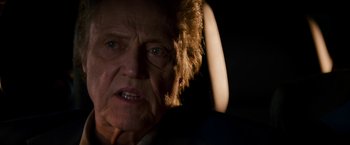 Movie still from “Stand Up Guys” (2012), directed by Fisher Stevens – An old woman with a strange look on her face; Close Up shot, Over the shoulder angle