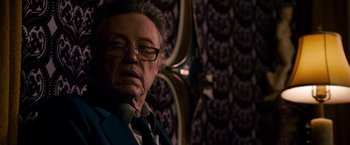 Movie still from “Stand Up Guys” (2012), directed by Fisher Stevens – An older man wearing a suit and tie; Close Up shot, Low angle