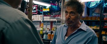 Movie still from “Stand Up Guys” (2012), directed by Fisher Stevens – An older man in a blue shirt is looking at the camera; Close Up shot, Over the shoulder angle