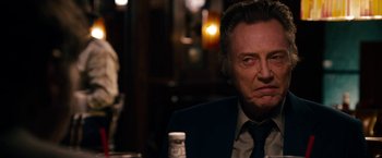 Movie still from “Stand Up Guys” (2012), directed by Fisher Stevens – An older man sitting at a table in front of a bottle of pills; Close Up shot, Over the shoulder angle