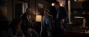 Movie still from “Stand Up Guys” (2012), directed by Fisher Stevens – A group of men standing next to each other in a room; Wide shot, Low angle
