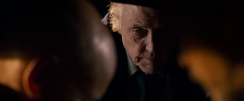 Movie still from “Stand Up Guys” (2012), directed by Fisher Stevens – An older man looking into a mirror with a reflection of himself in the mirror; Close Up shot, Over the shoulder angle