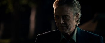 Movie still from “Stand Up Guys” (2012), directed by Fisher Stevens – An older man in a suit looking at the camera; Close Up shot, Over the shoulder angle