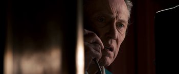 Movie still from “Stand Up Guys” (2012), directed by Fisher Stevens – An older man talking on a phone while holding it to his ear; Close Up shot, Low angle