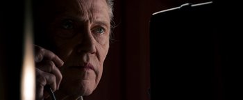 Movie still from “Stand Up Guys” (2012), directed by Fisher Stevens – An older man with a green eye looking at the camera; Close Up shot, Low angle