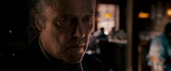 Movie still from “Stand Up Guys” (2012), directed by Fisher Stevens – An older man with a serious look on his face; Close Up shot, Over the shoulder angle