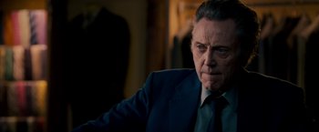 Movie still from “Stand Up Guys” (2012), directed by Fisher Stevens – An older man wearing a suit and tie; Close Up shot, Low angle