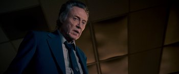 Movie still from “Stand Up Guys” (2012), directed by Fisher Stevens – An older man wearing a suit and tie; Close Up shot, Low angle