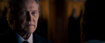 Movie still from “Stand Up Guys” (2012), directed by Fisher Stevens – An old man with a white beard and a black shirt; Close Up shot, Over the shoulder angle