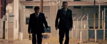 Movie still from “Stand Up Guys” (2012), directed by Fisher Stevens – A couple of men in suits walking down a street; Wide shot, Low angle