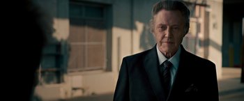 Movie still from “Stand Up Guys” (2012), directed by Fisher Stevens – An older man wearing a suit and tie; Close Up shot, Low angle