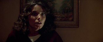 Movie still from “Starman” (1984), directed by John Carpenter – A person with a surprised look on their face; Close Up shot, Low angle