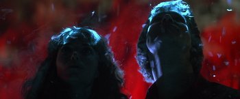Movie still from “Starman” (1984), directed by John Carpenter – Two people looking into the distance in the dark; Close Up shot, Low angle