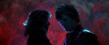 Movie still from “Starman” (1984), directed by John Carpenter – A man and a woman standing next to each other; Close Up shot, Low angle