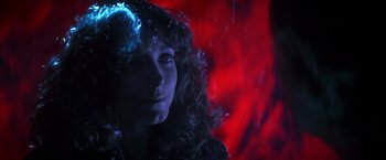 Movie still from “Starman” (1984), directed by John Carpenter – A person with curly hair; Close Up shot, Low angle