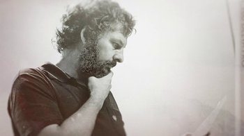 Movie still from “Street Gang: How We Got to Sesame Street” (2021), directed by Marilyn Agrelo – Black and white photograph of a man with a beard; Close Up shot, Low angle
