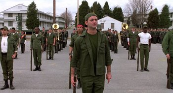 Movie still from “Stripes” (1981), directed by Ivan Reitman – A group of men marching down a street; Medium shot, Low angle