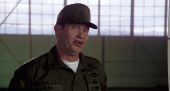 Movie still from “Stripes” (1981), directed by Ivan Reitman – A man in a military uniform talking to a camera; Close Up shot, Low angle