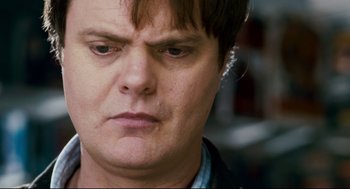 Movie still from “Super” (2010), directed by James Gunn – A person with short brown hair; Close Up shot, Over the shoulder angle