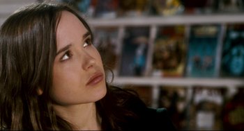 Movie still from “Super” (2010), directed by James Gunn – A person looking up at something; Close Up shot, Over the shoulder angle
