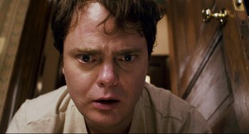 Movie still from “Super” (2010), directed by James Gunn – A person with his eyes wide open; Close Up shot, Overhead angle