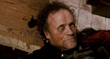 Movie still from “Super” (2010), directed by James Gunn – A person with blood all over his face; Close Up shot, High angle