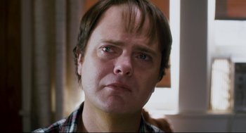 Movie still from “Super” (2010), directed by James Gunn – A person looking at the camera; Close Up shot, Over the shoulder angle