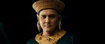 Movie still from “Ong Bak 3” (2010), directed by Tony Jaa – A person wearing a costume; Close Up shot, Low angle