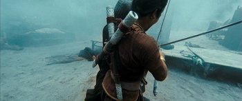 Movie still from “Ong Bak 3” (2010), directed by Tony Jaa – A woman is holding a sword in her hand; Medium shot, High angle