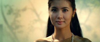 Movie still from “Ong Bak 3” (2010), directed by Tony Jaa – A beautiful young woman with long black hair; Close Up shot, Over the shoulder angle
