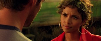 Movie still from “Swordfish” (2001), directed by Dominic Sena – A man and a woman that are talking to each other; Close Up shot, Over the shoulder angle