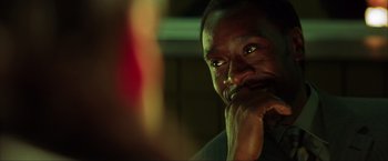 Movie still from “Swordfish” (2001), directed by Dominic Sena – A person with his hand under his chin; Close Up shot, Over the shoulder angle