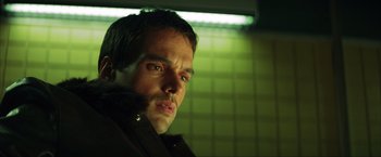 Movie still from “Swordfish” (2001), directed by Dominic Sena – A person wearing a jacket; Close Up shot, Low angle