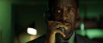 Movie still from “Swordfish” (2001), directed by Dominic Sena – A person talking on a cell phone; Close Up shot, Low angle