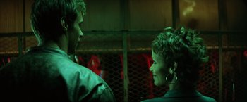 Movie still from “Swordfish” (2001), directed by Dominic Sena – A man and a woman talking to each other; Close Up shot, Over the shoulder angle