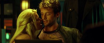 Movie still from “Swordfish” (2001), directed by Dominic Sena – A man and a woman kissing in a dark room; Close Up shot, Low angle