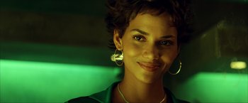 Movie still from “Swordfish” (2001), directed by Dominic Sena – A person wearing a green shirt; Close Up shot, Low angle