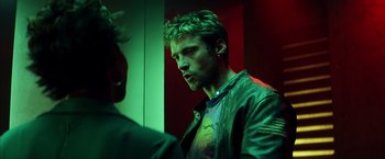 Movie still from “Swordfish” (2001), directed by Dominic Sena – A person wearing a jacket; Close Up shot, Over the shoulder angle