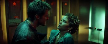 Movie still from “Swordfish” (2001), directed by Dominic Sena – A man and a woman talking to each other; Close Up shot, Over the shoulder angle