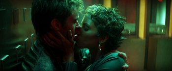 Movie still from “Swordfish” (2001), directed by Dominic Sena – A man and a woman kissing each other in a dark room; Close Up shot, Low angle