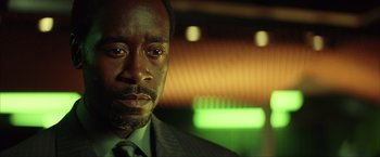 Movie still from “Swordfish” (2001), directed by Dominic Sena – A person wearing a suit and tie; Close Up shot, Low angle