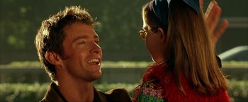 Movie still from “Swordfish” (2001), directed by Dominic Sena – A man and a woman are talking to each other; Close Up shot, Over the shoulder angle