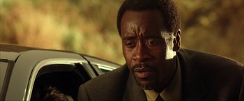 Movie still from “Swordfish” (2001), directed by Dominic Sena – A person wearing a suit and tie; Close Up shot, Low angle