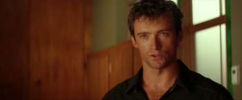 Movie still from “Swordfish” (2001), directed by Dominic Sena – A person wearing a black shirt; Close Up shot, Over the shoulder angle