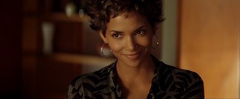 Movie still from “Swordfish” (2001), directed by Dominic Sena – A person with short hair; Close Up shot, Over the shoulder angle