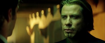 Movie still from “Swordfish” (2001), directed by Dominic Sena – A person wearing a suit; Close Up shot, Low angle