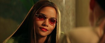 Movie still from “Swordfish” (2001), directed by Dominic Sena – A person wearing sunglasses; Close Up shot, Over the shoulder angle