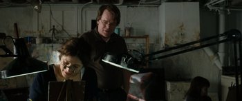 Movie still from “Synecdoche, New York” (2008), directed by Charlie Kaufman – A man and a woman standing in front of a mirror; Medium shot, Over the shoulder angle
